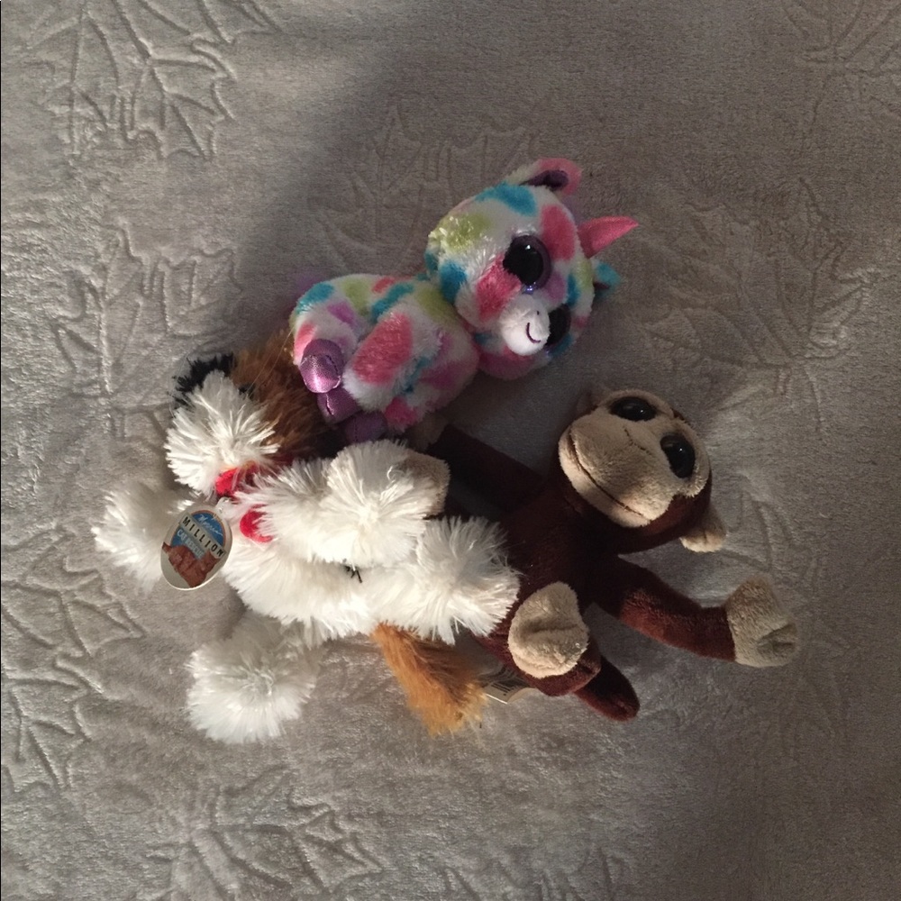 Stuffed animals monkey unicorn cat